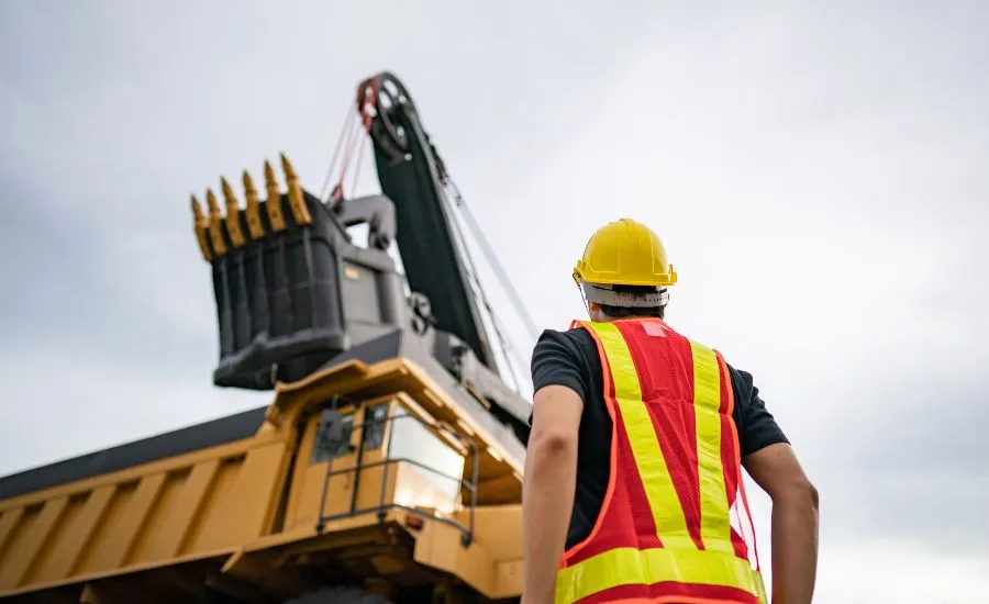 A worker looking at the machinery used for mining